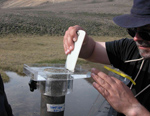 A sampling device lets researchers learn about a lake.